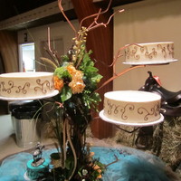 Country Scroll 10" rounds, all different flavors. Light ivory buttercream frosting with chocolate brown scroll work.