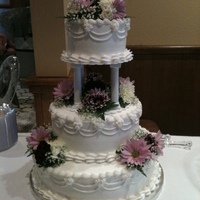 Purple & Lavendar 14", 10", 6" round. All buttercream with real flowers.