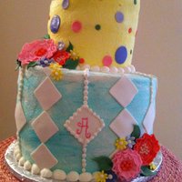 Tea Party Bridal Shower Vanilla sour cream cake with raspberry filling, buttercream base with fondant decorations and whimsical flowers