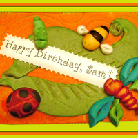 All Edible Decoration Fondant Rice Paper Edible Ink On Foamcore Base With Ribbon On Edge All edible decoration (fondant, rice paper, edible ink) on foamcore base with ribbon on edge.