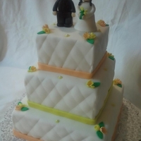 Orange And Yellow Theme Bridal Shower Cake fondant bride and groom