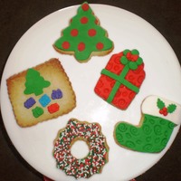 Christmas Cookies Orange flavored cookies with fondant decorations.