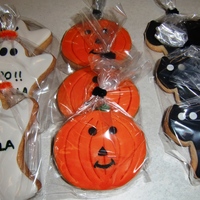 Halloween Cookies Orange flavored cookies with fondant decorations.