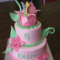 Tinkerbell Cake Fudge cake with pb filling and vanilla with strawberry filling, iced in buttercream with fondant/gumpaste decorations. Tink is a candle......