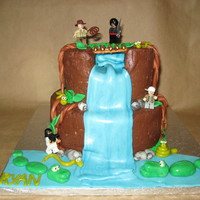 Indiana Jones Cake I made this for my nephew's 5th birthday. Notice the "rocks" in the butter cream mountain...happy accident when you forget...