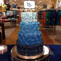 Blue Ombre Rosette Cake Belk's 125th Anniversary Celebration Cake This was created using the store's ombre colors with a handpainted sign.
