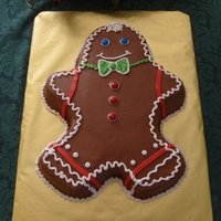 Gingerbread Man Cake Vanilla marbled cake with chocolate bc frosting. All bc and plain chocolate coated candies decorations.