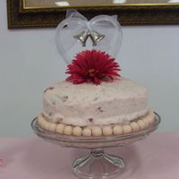 Pink Bridal Cake Fresh strawberry cake with strawberry cream cheese frosting, with strawberry peices in the frosting, with strawberry malted balls around...