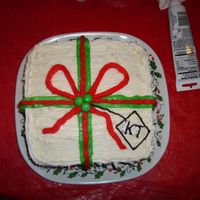 Present Cake My daughter made this for a family Christmas party last year. Its a simple chocolate cake with colored vanilla frosting, and then she put m...