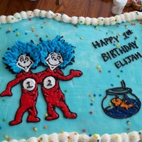 Thing 1 And Thing 2 Birthday Cake Transfered frozen buttercream outline and filled in with cookie glaze to achieve shiny efffect. Cupcake cake