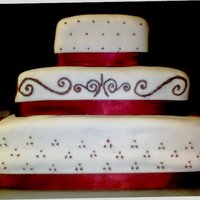 Burgundy Square cake with burgundy piping. They gave me a picture and I tried to replicate it.