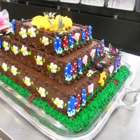 Brownie Cake Spring-themed cake made of brownies and fudge icing with buttercream accents.