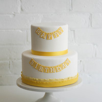 Yellow Happy Birthday Cake Chocolate cake with Oreo cookie French buttercream. Covered in fondant. Happy Birthday letters done with FMM Tappits.