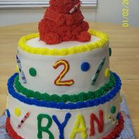Elmo With Crayons I made this for my son's 2nd birthday. Elmo is made from the mini stand up bear pan. Top layer is choc fudge with oreo filling. Bottom...