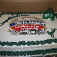 Wrestling Medal Cake was made to match a wrestling medal that was received. Graduation cake featured medal.