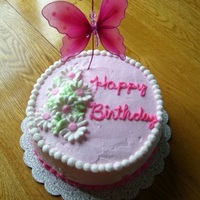 Daisy Cake I made this for a girl's birthday. They wanted a "girly" cake. I used the flowers I made for my Wilton III Course. They...
