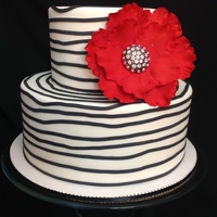 Bridal Show Cake inspiration for this design came from a fellow CC'er thank you!The cake is all fondant. with a gumpaste flower.