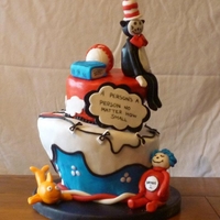 Dr Seuss Baby Shower Cake! This is a carrot cake and creme cheese topst turvy cake! its covered in MMF and the characters are made from gumpaste!