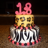 18Th Birthday Cake! This is a red velvet cake filled with cream cheese icing tht i made for my friends 18th birthday! the 18 on top is made out of gumpaste and...