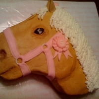 Palomino Head Little girl's birthday cake. She shows palominos.... All buttercream with fondant harness and ribbon.