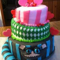 Alice In Wonderland Cheshire Cat 6", 8", and 10" topsy French vanilla cake with vanilla buttercream filling; fondant covered; all decorations are fondant....