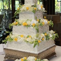 Crystal's Cake 16", 12", 8" and 4" square tiers iced in buttercream, with buttercream piping and edible pearls