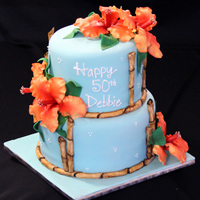 Hawaiian Birthday Cake Hawaiian themed birthday cake. All flowers and bamboo made from gumpaste and fondant. TFL!