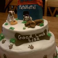 Good Luck yellow wasc cake, cream filling and french vanilla buttercream. Fondant/gumpaste dogs and accents. Pet hotel is made from rice krispy...