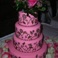 N512938403_568264_527.jpg I loved this cake. I was so proud of myself that it looked exactally like the photo the bride gave me. Mt piping was great, my fondant was...