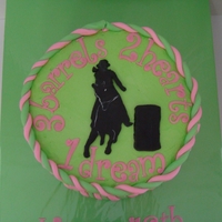 Pink & Green Barrel Racer 8 inch buttercream with fondant accents. White accent on silhouette done with white food coloring.