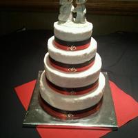 Simple Black & Red 12" almond, 10" pumpkin chocolate chip, 8" chocolate peanut butter chip, and 6" vanilla rounds with buttercream...