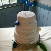 Shakespeare Wedding 10", 8", 6" round tiers covered in fondant with a Shakespeare sonnet done in fondant & brushed in silver.