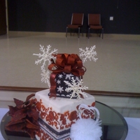 Christmas Wedding Sudden request for a Christmas Wedding for GI home for the holidays. White cake buttercream icing fondant bow and decorations airbrushed...