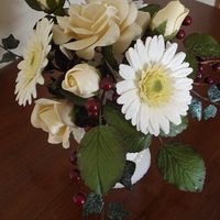 Sugar Paste Flower Bouquet This is my first sugar paste flower bouquet. I made a sugar vase and filled it with gerber daisies, roses, rose leaves, ivy and burgandy...