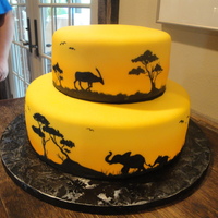 Safari Groom's Cake This was a 2-tier round cake, covered in yellow fondant and hand-painted with gel food coloring. It had all the animals on it that the...