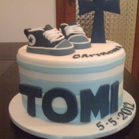 Converse Christening Cake Choc mint mud, everything is edible the shoes and cross are made of gumpaste whilst the rest is fondant