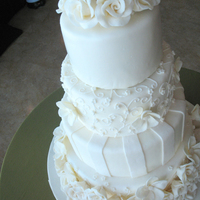 White Rose Cake This is not an original design and unfortunately I don't know whose it is... but it looks pretty different anyway. Turned out taller....