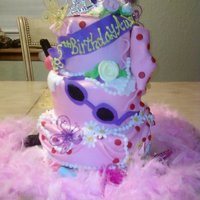 Fancy Nancy Cake fancy nancy cake with some fondant decorations and some nonedible decorations.