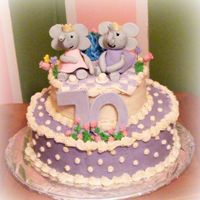 And Elephant Cake! This is a cake i made for a woman who was turning 70 that loves elephants and purple! The elephants are gumpaste, and even though you cant...