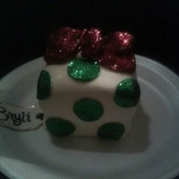 December Birthday Gift Cake White chocolate peppermint cake with candy cane buttercream and MMF bow and cut outs :) Inspired by a PinkBox Cakes design. I forgot to...