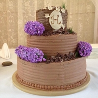 Lilac And Wheatgrass Wedding Cake This is my first wedding cake. 2 tiers of chocolate cake with chocolate icing. 1 tier of white almond sourcream cake with chocolate icing....
