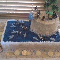 Pirate Birthday Cake Bottom is chocolate with fudge filling, island is WASC with Bavarian Cream filling. Used Sugar Shack's icing and Nilla Wafers for the...
