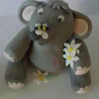 Elephant And The Bee Cute little elephant watching the bee that has landed on his nose