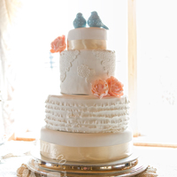 Vintage Lace & Ruffles Wedding Cake This beautiful wedding cake featured design elements especially requested by the bride: lace appliqu&eacute;, large delicate blooms,...