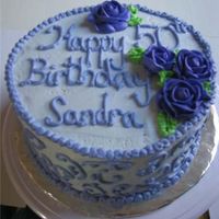 Purple Birthday 8" round cake with buttercream icing and decorations. This is my first time making roses in almost 4 1/2 years. Yikes!