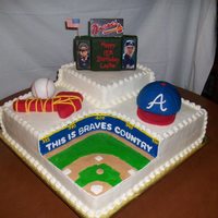 Atlanta Braves/turner Field Cake was done in buttercream with scoreboard, baseball hat, baseball and tomahawk were done in RKT and covered with fondant. Back of the...