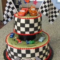Cars Black fondant squares used to make the black and white side design... real cars and plastic flags.