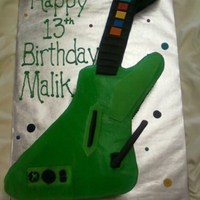 Guitar Hero Chocolate marble cake, buttercream filling and frosting, fondant accents. Even though the guitar in the game is white, the child's...