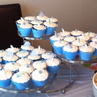 Baby Shower Cupcakes 1.5 doz vanilla and 1.5 doz chocolate cupcakes all iced with vanilla buttercream. Wrappers were cut using my Cricut and some scrapbook...