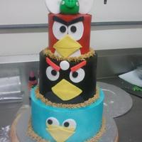 Red, Black, Blue Angry Birds Tier Thanks for the ideas!! Airbrushed buttercream icing with fondant details. Fondant pig and eggs!